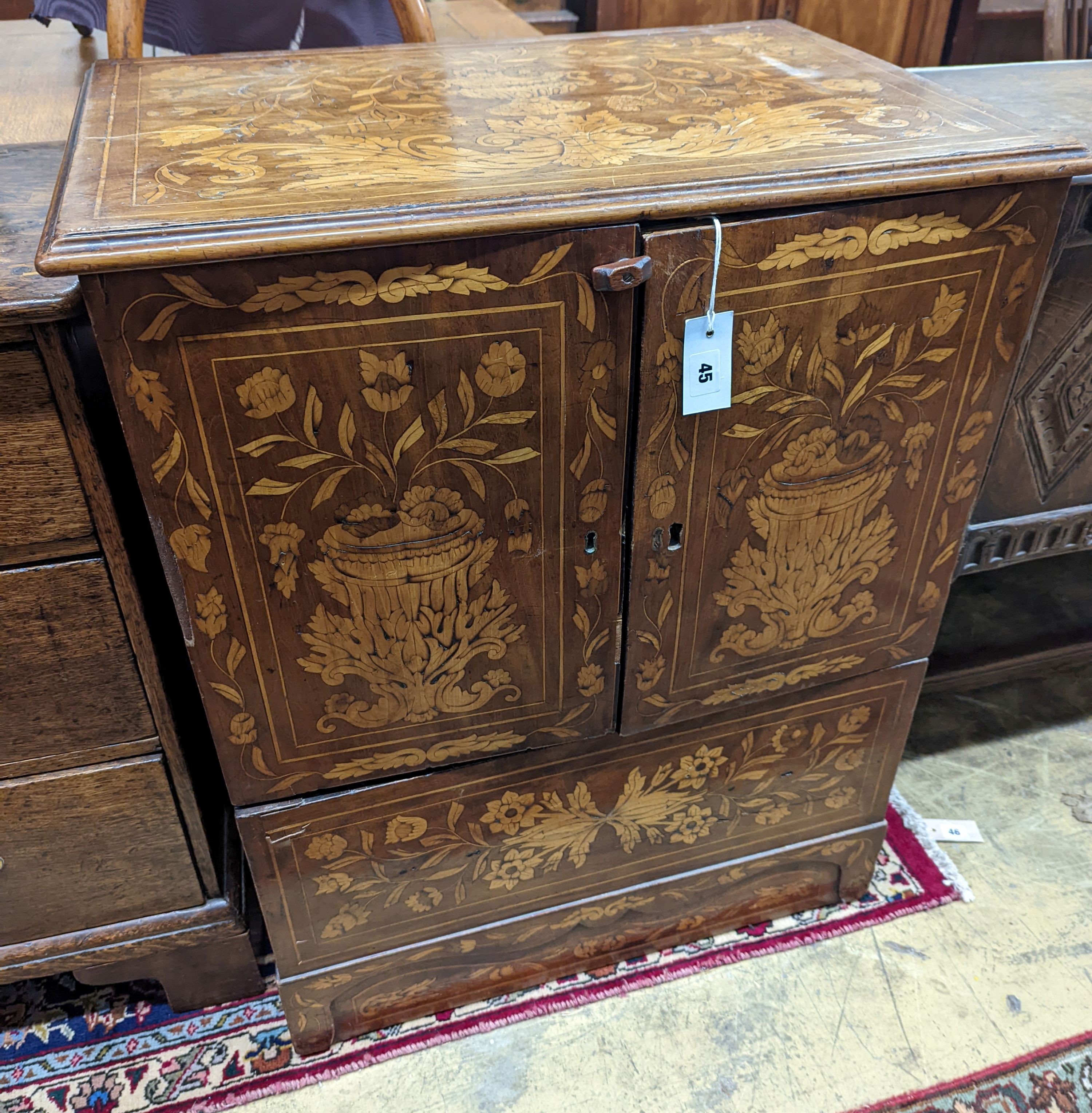 An 18th century Dutch floral marquetry walnut cabinet (altered), width 70cm, depth 48cm, height 87cm